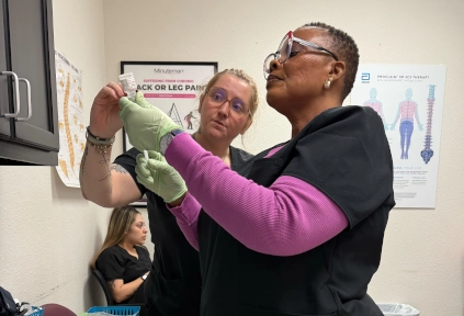 medical assistant student training with their instructor