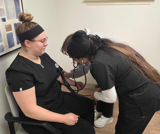Medical Assistant School Student measuring a patient's blood pressure